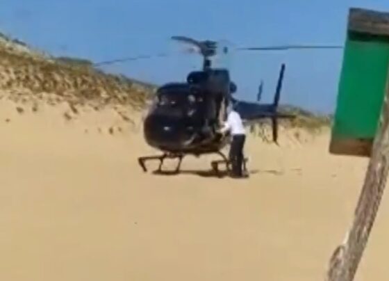 Imagem colorida, Empresário pousa helicóptero em praia para comprar piaba frita. Vídeo - Metrópoles
